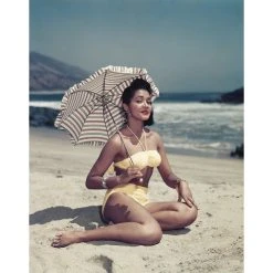 Jonathan Adler "Woman On Beach Holding Umbrella" From Getty Images